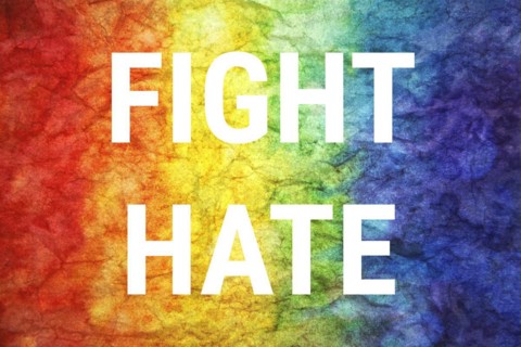 Fight hate words on LGBT textured background