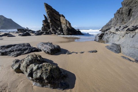 Rocky coast and sandy beach at Praia da Adraga