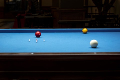 Billiard balls on a billiard table