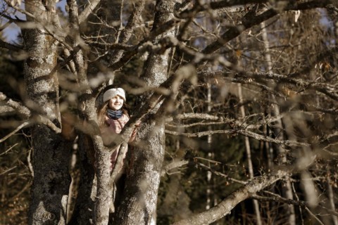 Girl climbing in a tree