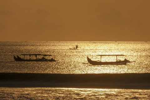 Fishing outriggers on the beach of Kuta