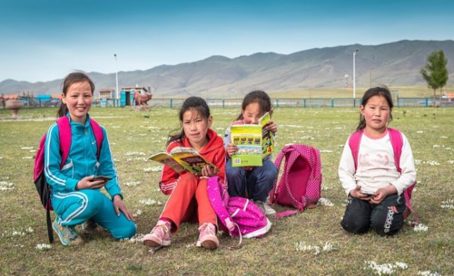 Schoolgirls reading books in their free time. Bulgan frovince