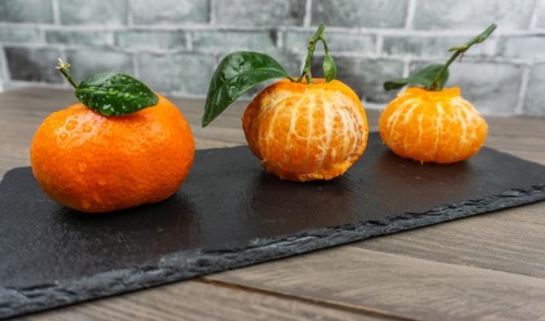 Fresh tangerines sweet clementines with drops of water