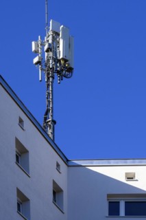 Antenna mast on flat roof