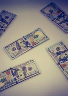 American 100 dollar banknote bundles placed on white background