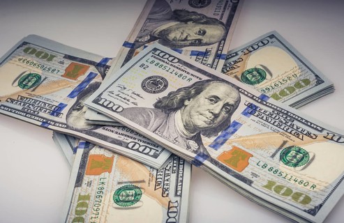 American 100 dollar banknote bundles placed on white background