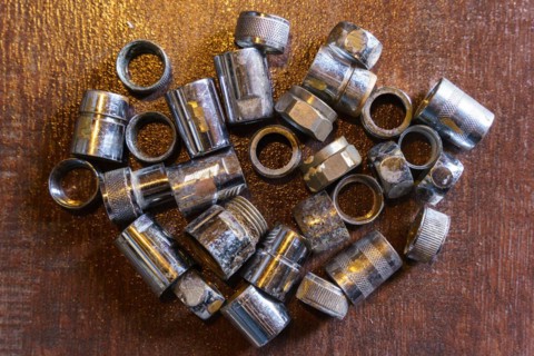 Old brass nuts and fittings for plumbing use recycling. Recycling of non-ferrous scrap