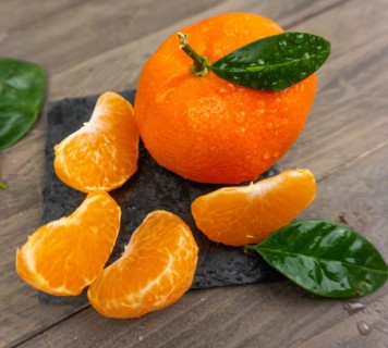 Fresh tangerines sweet clementines with drops of water