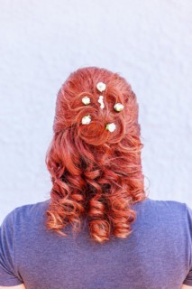 Rear head view of a red-haired woman