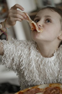 Girl eats a pizza