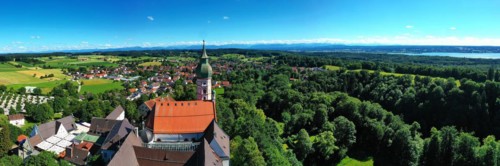 Aerial view of Andechs Monastery with the Alps in the background. Andechs