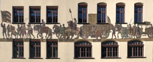 Historical mural of a medieval merchant procession
