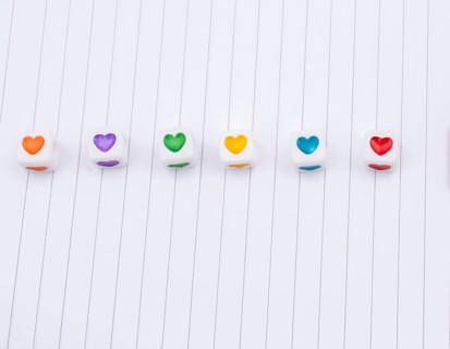 Love cubes and paper arrow on a notebook
