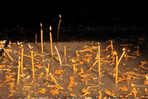 Sacrificial candles in monastery. The Voronet Monastery