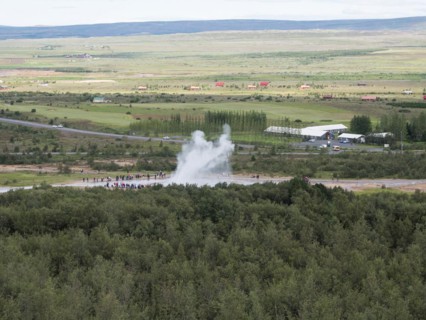 Tourists watch eruption