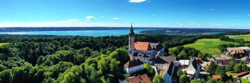 Aerial view of Andechs Monastery with the Lake Ammer lake in the background. Andechs