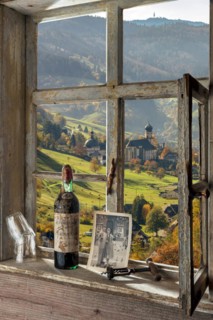 Farmhouse parlour with wine bottle