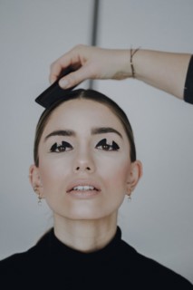Woman styling her hair