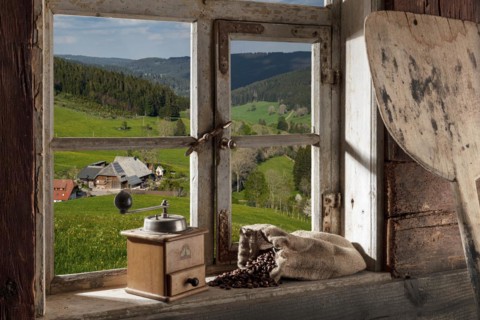 Farmhouse parlour with coffee grinder and coffee beans on the windowsill