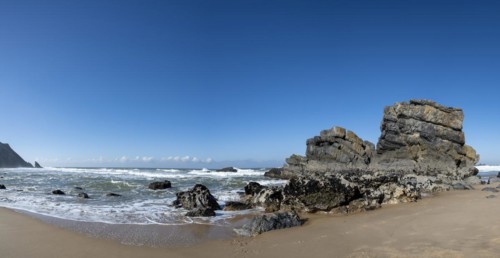 Rocky coast and sandy beach at Praia da Adraga