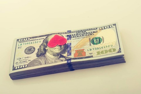 Red hearts and banknote bundle of US dollar