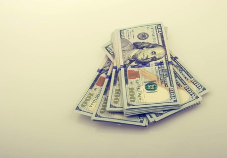 American 100 dollar banknote bundles placed on white background