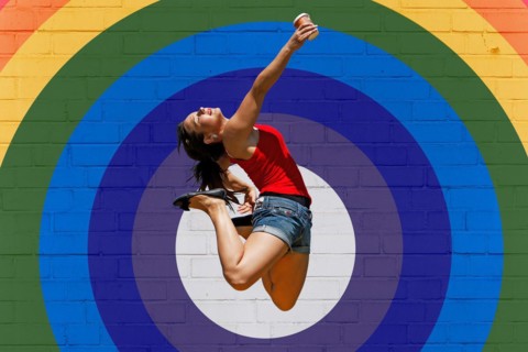 Young woman jumps for joy