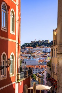 View over the old town of Lisbon to the castle Castelo de Sao Jorge
