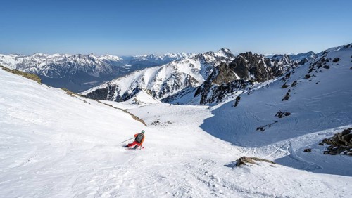 Skiers descending from Pirchkogel in the snow valley