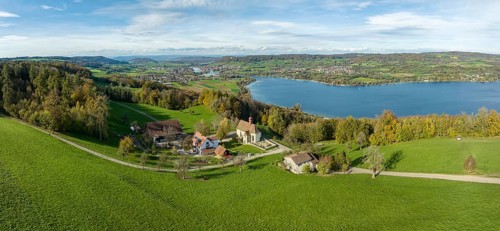 View from the Thurgau lake ridge slope to the farm settlement of Klingenzell with the Marian pilgrimage chapel of Our Lady of Sorrows