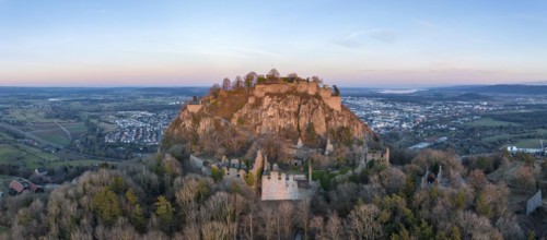 Panorama of the volcanic cone Hohentwiel with the castle ruins illuminated by the evening sun