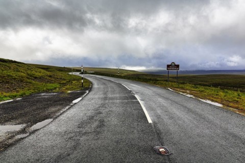 Winding country road in hilly landscape