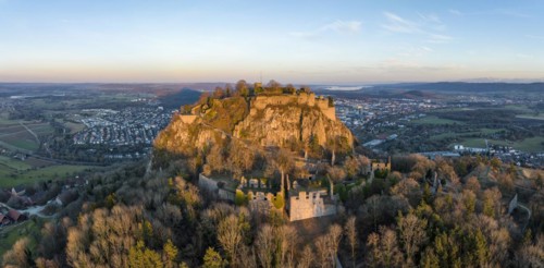 Panorama of the volcanic cone Hohentwiel with the castle ruins illuminated by the evening sun