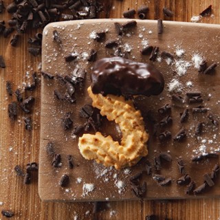 Shortbread with chocolate on wood