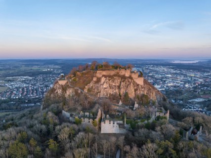 The volcanic cone Hohentwiel with the castle ruins illuminated by the evening sun