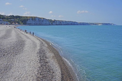 Angler on the shingle beach