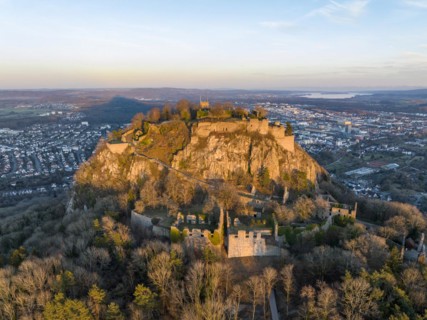 The volcanic cone Hohentwiel with the castle ruins illuminated by the evening sun