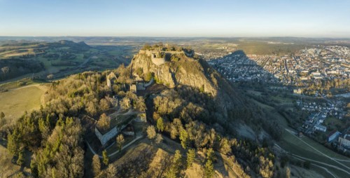 Panorama of the volcanic cone Hohentwiel with the castle ruins illuminated by the evening sun