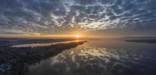 Lake Constance reflected in the morning sky with sunrise