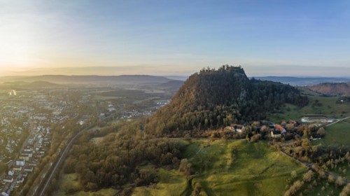 The volcanic cone with the Hohentwiel castle ruins illuminated by the morning sun