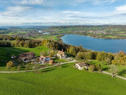 View from the Thurgau lake ridge slope to the farm settlement of Klingenzell with the Marian pilgrimage chapel of Our Lady of Sorrows
