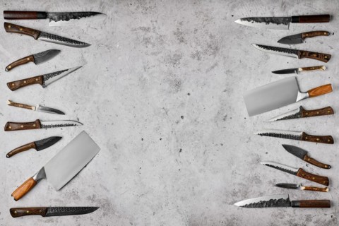 Overhead composition with different kinds of butchers knives