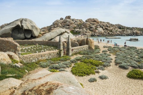 Granite rocks and cemetery on the beach