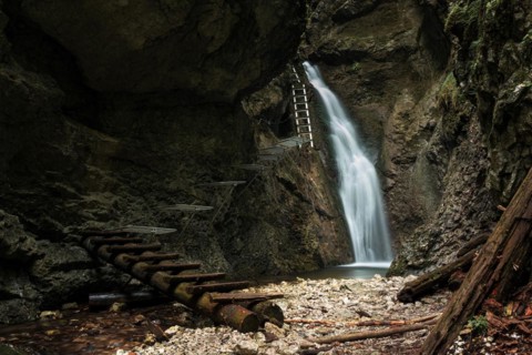 Difficul trail with ladder near the waterfall in canyon of National park Slovak paradise