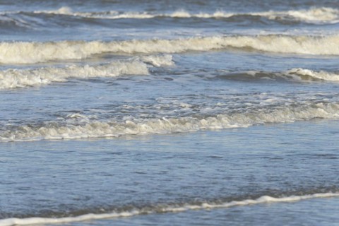 Leaking waves on a sandy beach