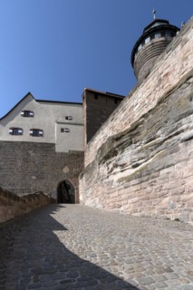 Paved road to the Kaiserburg on the left of the Sinwell Tower