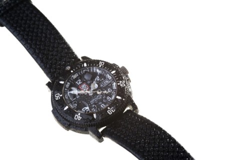 A waterproof wristwatch with water droplets