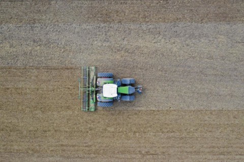 Tractor with rotary harrow