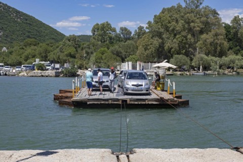Cars on primitive cable ferry crossing the Vivari Channel near Butrint National Park
