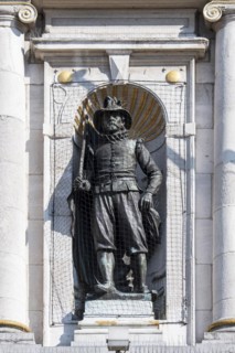 Statue protected with anti-bird net and anti roosting spikes against city pigeons at the Nederlands Toneel Gent